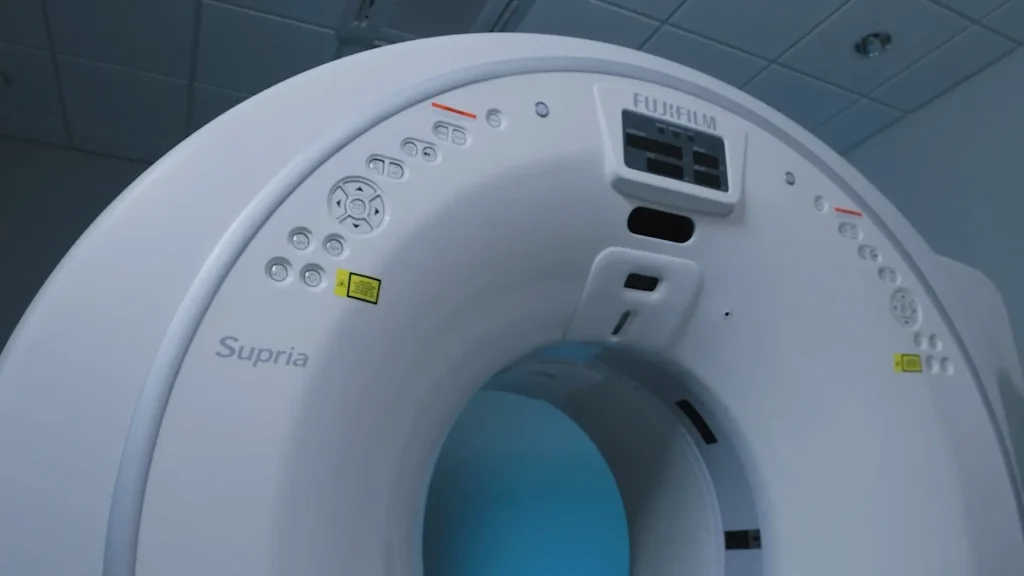 Close-up of the Fujifilm Supria Plus CT scanner gantry controls and bore opening