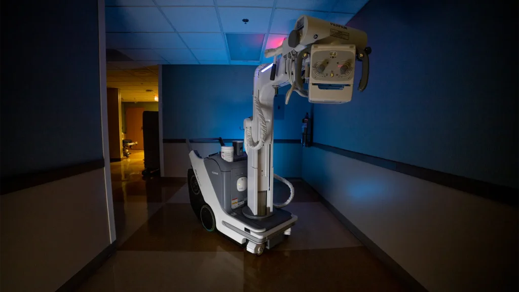 Fujifilm portable X-ray unit parked in a dim hospital hallway