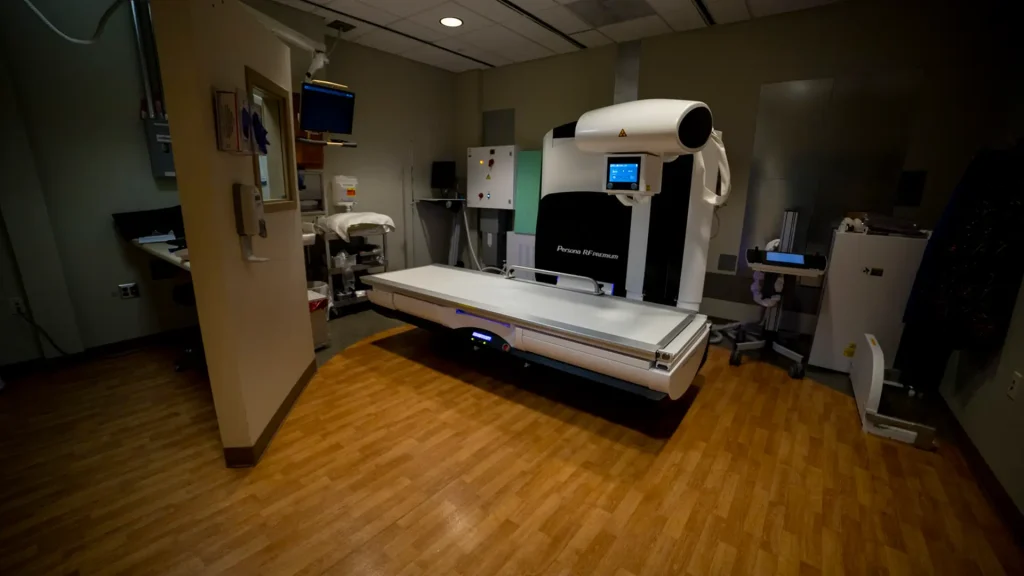 Fujifilm Persona RF Premium fluoroscopy system with imaging table in a dim exam room