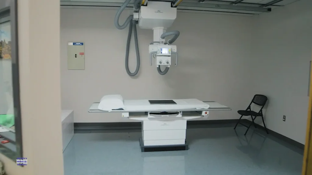 Fujifilm D-EVO Suite II X-ray system with overhead tube column and imaging table in an exam room