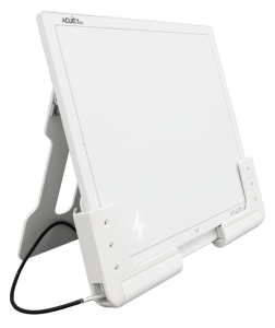 Acuity DRe flat panel detector docked in its charging stand at an angle, with charging indicator lit