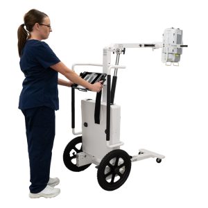 Technologist positioning the Acuity PDR mobile X-ray system's tube arm and detector