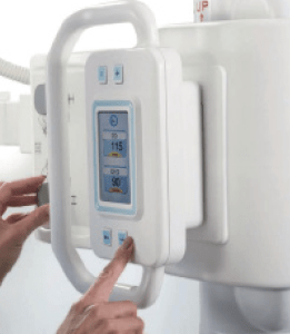 Close-up of hands operating the Essentia FS tube head's touchscreen control panel