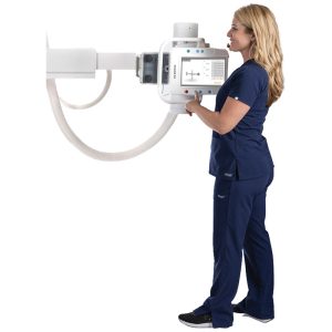 Technologist holding and operating the built-in control panel on the Essentia SA tube head