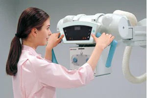 Technologist adjusting the RADspeed Pro Style Edition FMT tube head control panel