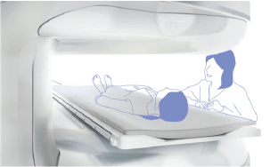 Illustration of a patient positioned inside the APERTO Lucent's open magnet bore with a technologist nearby