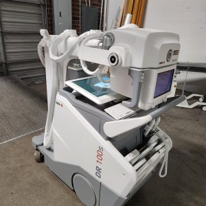 Agfa DR 100s mobile X-ray unit, front-angled view showing tube head, touchscreen, and keyboard in warehouse