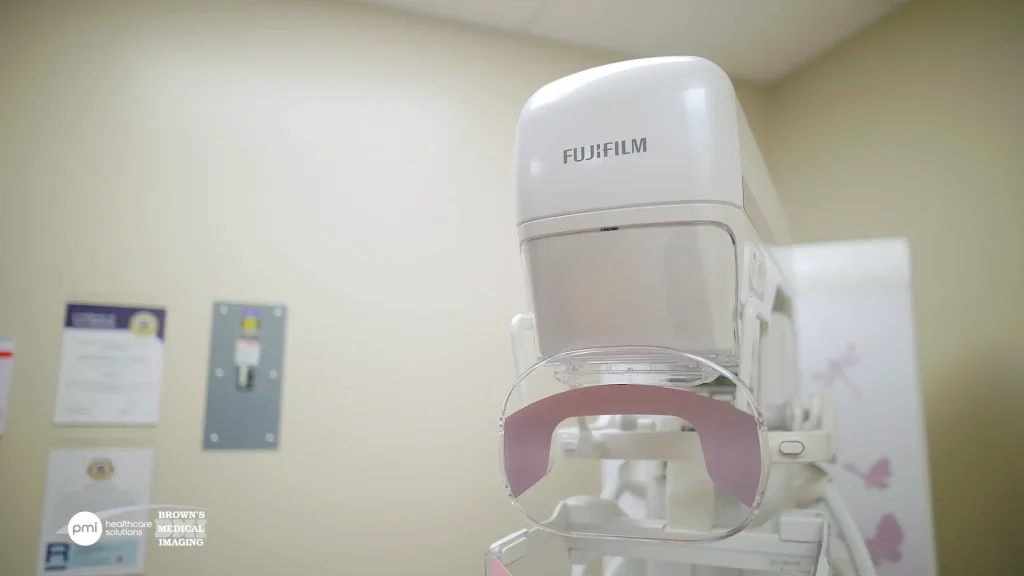 Close-up of a Fujifilm mammography system's compression paddle and gantry