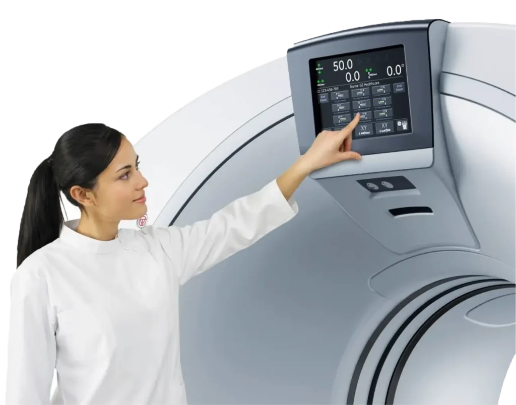 Technician touching the touchscreen control panel on a GE Revolution EVO CT scanner gantry