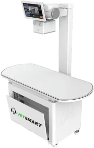 VetSmart veterinary X-ray table shown from an angled view with overhead arm and cabinet logo