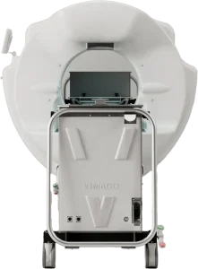 Front view of the Vimago cone beam CT scanner bore showing the control panel and detector mounted inside the opening