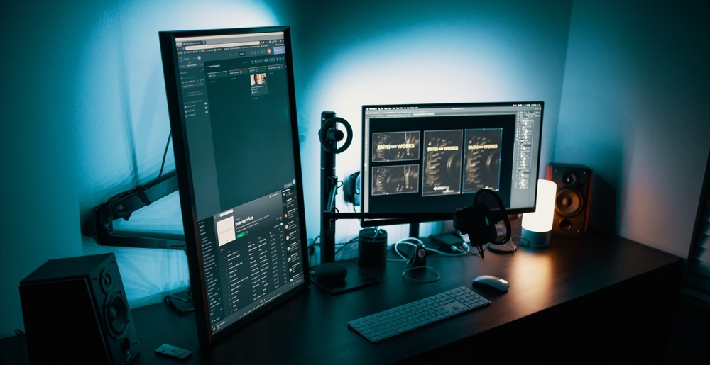 Dark home office setup with dual monitors displaying imaging software and diagnostic scan panels