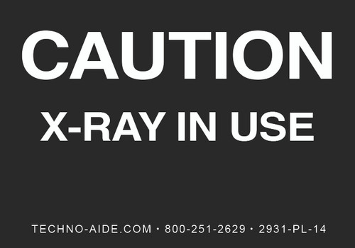 Black illuminated caution sign reading "CAUTION X-RAY IN USE"