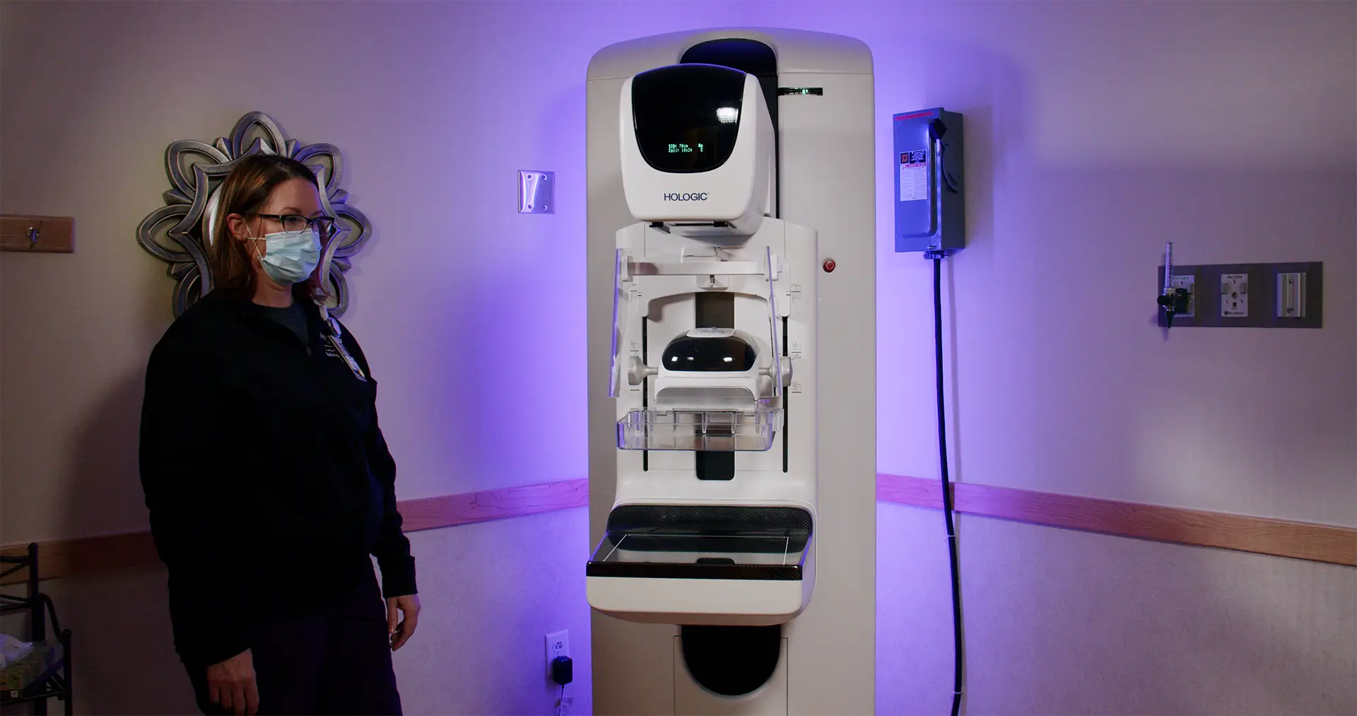 Brown's Medical Imaging technologist working with a Hologic mammography system