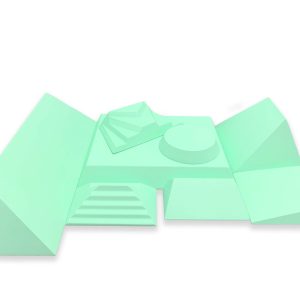 Bundle of green coated foam urgent care sponges in assorted wedge, step, and block shapes