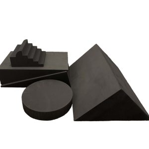 Bundle of dark gray closed cell foam clinic sponges, including a stepped block, cylinder, and wedge